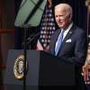 President Biden speaks while visiting the National Institutes of Health in Maryland on Thursday. Biden sketched out his latest plan to quell the pandemic that's dogged his presidency, with two U.S. cases of the omicron variant now confirmed and threatening to fuel an already high case count.