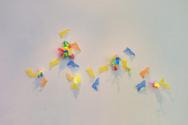 Small LED and 3d printed sculptures on a white wall