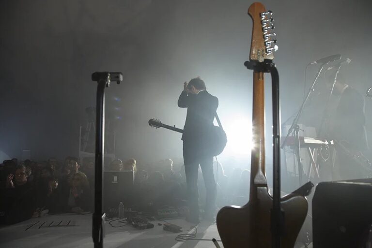 A still photograph from a video by Ragnar Kjartansson of the band The National performing the song "Sorrow" on stage for six hours.