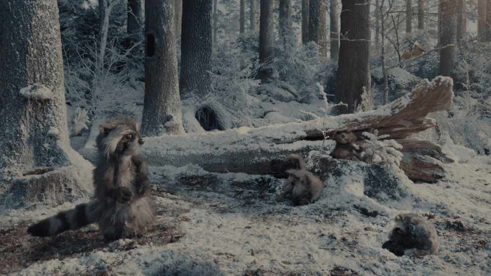 A gif from a short film by Apple featuring woodland creature puppets in a snowy forest